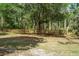 Scenic fenced yard with mature trees, perfect for pets or outdoor activities at 19263 Quiet Oak Ln, Brooksville, FL 34604