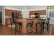 Kitchen featuring a large island with bar seating, stainless steel appliances, and granite countertops at 19263 Quiet Oak Ln, Brooksville, FL 34604
