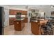 Well-appointed kitchen with stainless appliances, granite counters, and convenient bar seating at 19263 Quiet Oak Ln, Brooksville, FL 34604