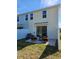 Cozy backyard featuring a patio with stylish seating, offering a relaxing outdoor space perfect for enjoying the fresh air at 20338 Lou Angela Ln, Lutz, FL 33558