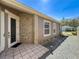 Close-up of the home's entrance, highlighting the tiled walkway, ornate door, and well-lit path at 3555 Sylvan Edge Dr, Palm Harbor, FL 34685