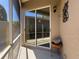 Screened porch with sliding glass doors and outdoor decor at 3555 Sylvan Edge Dr, Palm Harbor, FL 34685