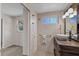 Updated bathroom with stylish vanity, decorative mirror, and neutral tile at 3728 Linkwood St, New Port Richey, FL 34652