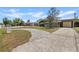 View of the home's driveway and surroundings showcasing the neighborhood, curb appeal, and the home's setting at 3728 Linkwood St, New Port Richey, FL 34652