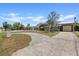 Charming single-story home with a long drive, mature tree, and well-maintained front yard at 3728 Linkwood St, New Port Richey, FL 34652