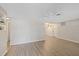 Open living room with neutral walls, wood-look floors, and a ceiling fan at 3728 Linkwood St, New Port Richey, FL 34652