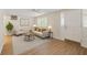 Inviting living room with sleek floors, shutters, and neutral color scheme at 3728 Linkwood St, New Port Richey, FL 34652