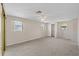 Spacious main bedroom featuring neutral carpet, bright windows, and closet storage at 3728 Linkwood St, New Port Richey, FL 34652
