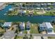 Aerial view of canal-front homes showing neighborhood with waterfront access and boating opportunities at 4046 Casa Ct, Hernando Beach, FL 34607