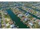 Aerial view of waterfront community, showcasing numerous canals and private boat docks at 4046 Casa Ct, Hernando Beach, FL 34607