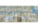 Aerial view showcasing the property's location among waterfront homes along a canal at 4046 Casa Ct, Hernando Beach, FL 34607