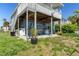Inviting backyard featuring patio, outdoor living space, and lush greenery at 4046 Casa Ct, Hernando Beach, FL 34607
