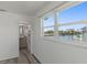 Bright bathroom entrance with a view of the water at 4046 Casa Ct, Hernando Beach, FL 34607