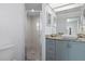 Bathroom featuring updated shower and vanity with granite countertop at 4046 Casa Ct, Hernando Beach, FL 34607