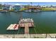Waterfront property featuring a private dock with boat and kayak access for scenic waterway enjoyment at 4046 Casa Ct, Hernando Beach, FL 34607