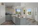Bright kitchen with granite countertops and views from the surrounding windows at 4046 Casa Ct, Hernando Beach, FL 34607
