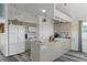 Well-lit kitchen features granite countertops, stainless steel appliances, and ample cabinet space at 4046 Casa Ct, Hernando Beach, FL 34607