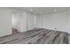 Spacious living room with modern flooring and multiple entryways at 4046 Casa Ct, Hernando Beach, FL 34607