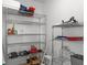 Pantry shelves with assorted food items and cooking supplies at 4046 Casa Ct, Hernando Beach, FL 34607