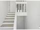 Bright staircase with white trim and light wood steps leading to the upper level of the home at 4046 Casa Ct, Hernando Beach, FL 34607