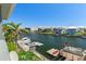 Scenic waterfront view with a canal, boats, docks and nearby tropical homes at 4046 Casa Ct, Hernando Beach, FL 34607