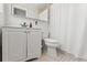 Clean bathroom features a white vanity and tiled shower and bathtub combo at 422 Crosswinds Dr, Palm Harbor, FL 34683