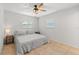 Clean bedroom features fan, one window, and neutral colored walls and floors at 422 Crosswinds Dr, Palm Harbor, FL 34683