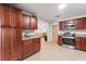 Kitchen with modern appliances, tile backsplash, and ample cabinet space at 422 Crosswinds Dr, Palm Harbor, FL 34683