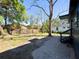 Spacious backyard featuring mature trees and a partially fenced perimeter at 4601 N 37Th St, Tampa, FL 33610