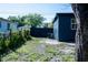View of the backyard with a fenced perimeter and mature trees providing ample shade at 4601 N 37Th St, Tampa, FL 33610