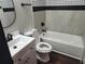 Bathroom with tile accents, modern fixtures, and a combined shower and bathtub at 4601 N 37Th St, Tampa, FL 33610