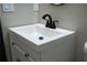 A close up on bathroom sink with cabinet and modern fixtures at 4601 N 37Th St, Tampa, FL 33610