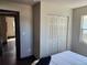 Bedroom featuring a built in closet and view to the next room with hardwood floors at 4601 N 37Th St, Tampa, FL 33610