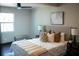 Bedroom with natural light, neutral colors, stylish lamps, and decorative pillows at 4601 N 37Th St, Tampa, FL 33610