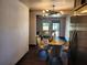Bright dining area with hardwood floors, a modern light fixture, and a round table at 4601 N 37Th St, Tampa, FL 33610
