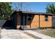 A charming single-story home with a two-tone exterior and a well-maintained front yard at 4601 N 37Th St, Tampa, FL 33610