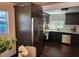 Eat-in kitchen featuring dark cabinets, stainless steel appliances, and a modern design at 4601 N 37Th St, Tampa, FL 33610