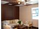 Comfortable living room featuring stylish ceiling design, accent wall, and ample natural light at 4601 N 37Th St, Tampa, FL 33610
