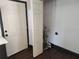 View of utility room with white walls and dark trim at 4601 N 37Th St, Tampa, FL 33610