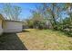 View of an expansive backyard, offering ample space for outdoor activities and gardening at 4743 Foothill Dr, Holiday, FL 34690