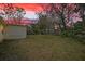 Expansive backyard with mature trees at 4743 Foothill Dr, Holiday, FL 34690