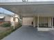 Spacious carport with room for parking and a small seating area; great for outdoor relaxation at 4743 Foothill Dr, Holiday, FL 34690