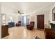 Inviting living room featuring tile floors, a ceiling fan, comfortable seating, and a front door at 4743 Foothill Dr, Holiday, FL 34690