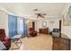 Cozy living room with comfortable furniture, ceiling fan, and natural light at 4743 Foothill Dr, Holiday, FL 34690