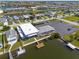 Aerial view showing the building's proximity to canal with dock, parking, and nearby homes at 4924 Dory Dr, New Port Richey, FL 34652