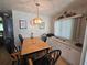 Dining room with table, chairs, built-in storage and natural light at 5211 Wisteria Cir, New Port Richey, FL 34653