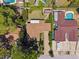 Aerial view of the home showcasing its well-manicured lawn and proximity to neighboring homes and pools at 6433 Murray Hill Dr, Tampa, FL 33615