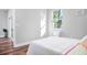 Bright bedroom with a window and minimalist decor at 6514 Grapewood Rd, Spring Hill, FL 34609