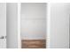 Walk-in closet with white walls, wire shelving, and wood-look floors at 6514 Grapewood Rd, Spring Hill, FL 34609