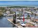 Wide aerial view of waterfront property featuring access to open water, boating canals, and lush surroundings at 6522 Nautical Isle, Hudson, FL 34667